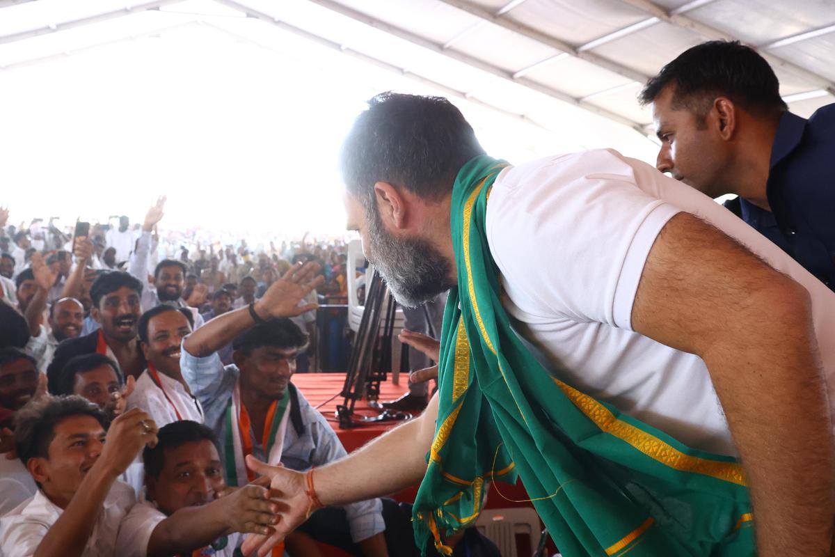 Youngsters vie with each other for a handshake with Congress leader Rahul Gandhi at a public meeting in Nirmal Town on Sunday.