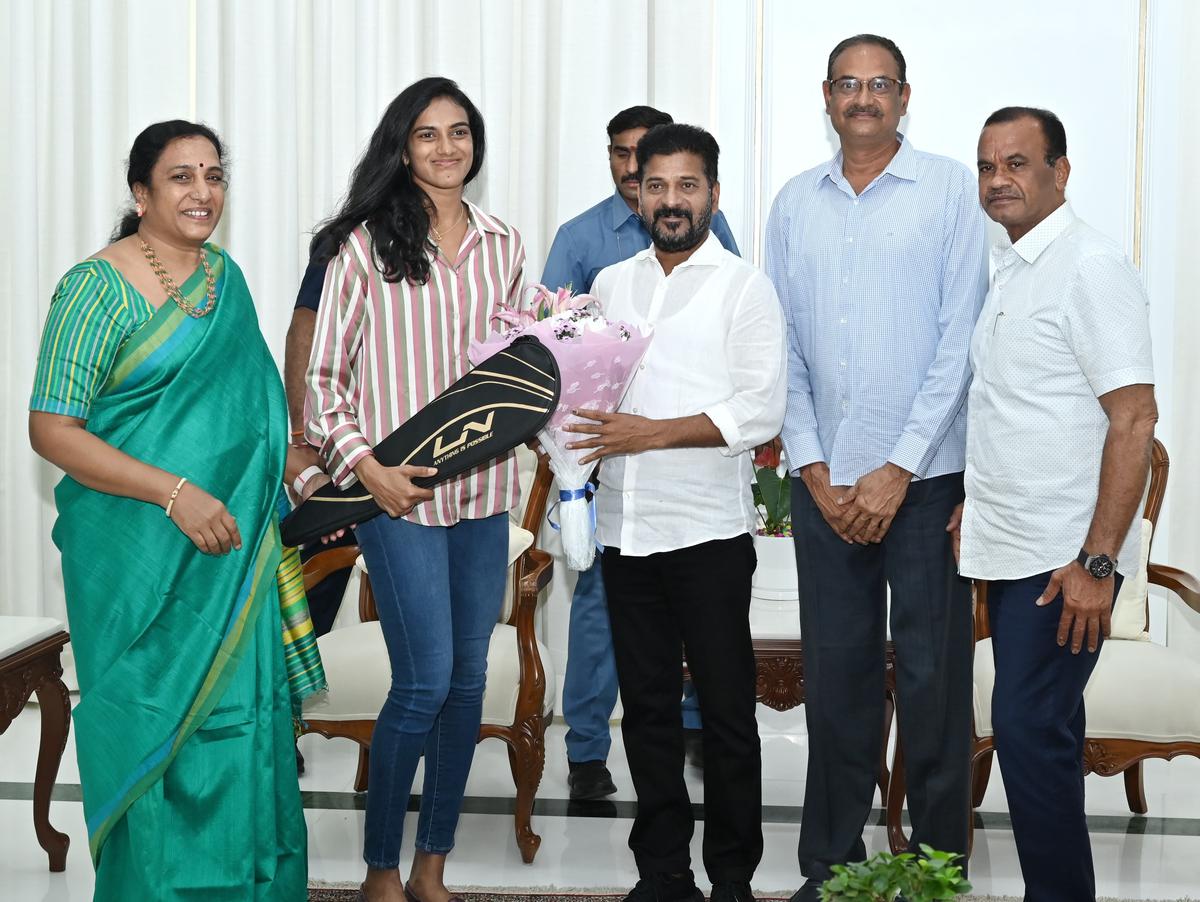 Ace badminton champion PV.Sindhu and her parents with Chief Minister A. Revanth Reddy