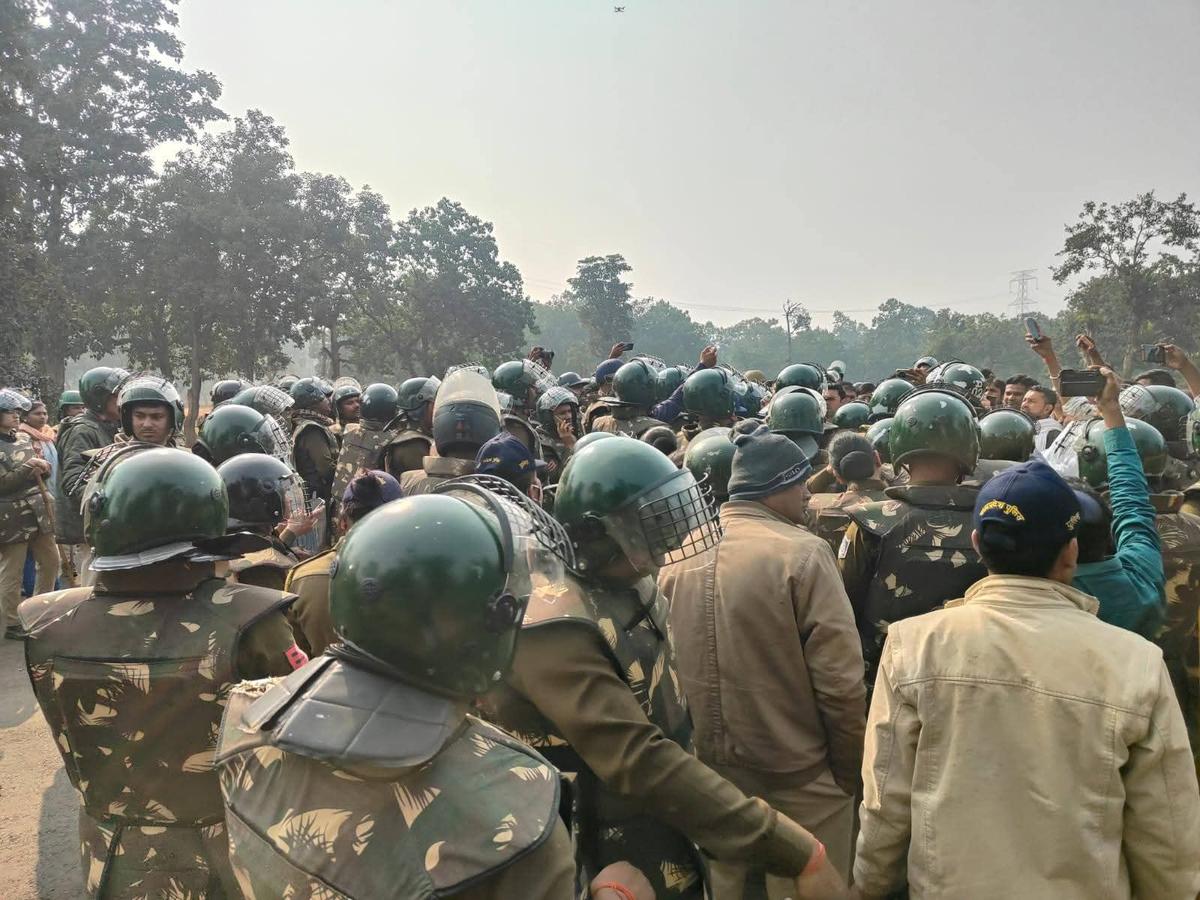 Police deployed in large numbers during a Congress protest on November 23, 2025, in Basi Berdaha village against the ongoing tree felling for a coal mining project of the Adani Group in Madhya Pradesh’s Singrauli district. Police deployed in large numbers during a Congress protest on November 23, 2025, in Basi Berdaha village against the ongoing tree felling for a coal mining project of the Adani Group in Madhya Pradesh’s Singrauli district.