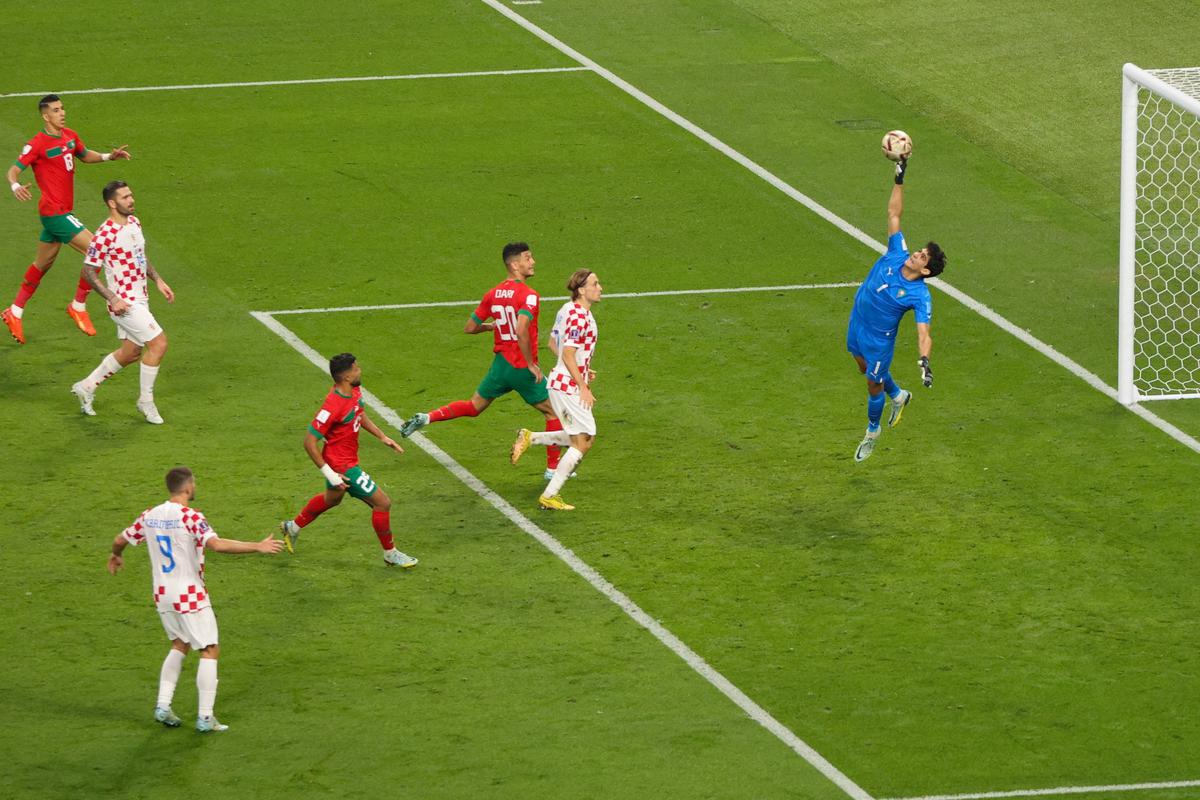 Morocco’s goalkeeper Yassine Bounou concedes Croatia’s second goal scored by Croatia’s forward Mislav Orsic during the Qatar 2022 World Cup football third-place play-off match between Croatia and Morocco at Khalifa International Stadium in Doha on December 17, 2022. 