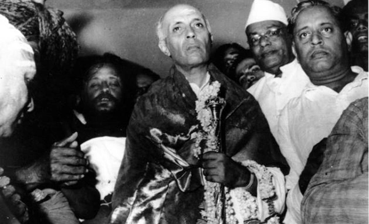 In this image released by the Ministry of Home Affairs, former Prime Minister Jawaharlal Nehru is seen holding the ‘sengol‘