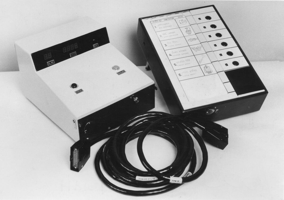 The two units of the BEL Electronic Voting Machine.  On left is the control unit with the polling officer; on right is the balloting unit on which the voter casts his vote. Photo Credit: The Hindu Archives