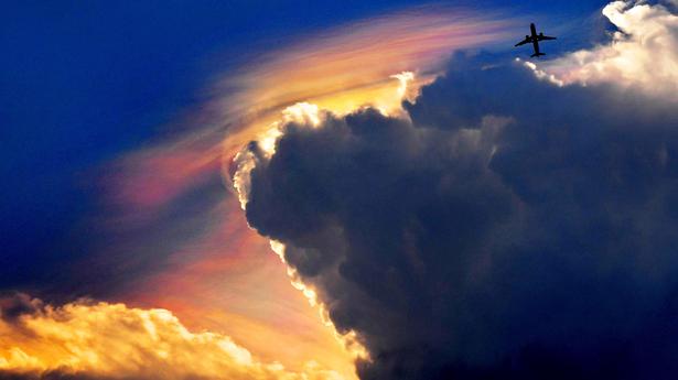 What causes rainbow clouds?