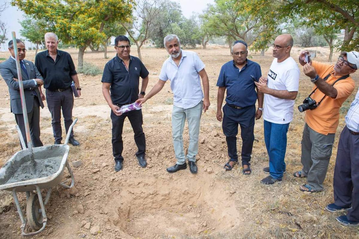 Community leaders Nehemia Shahaf and Avner Isaac (centre) participate in the laying of the foundation stone for the Heritage and Cultural Center of Indian Jews in Nevatim, Israel, on June 8, 2023.