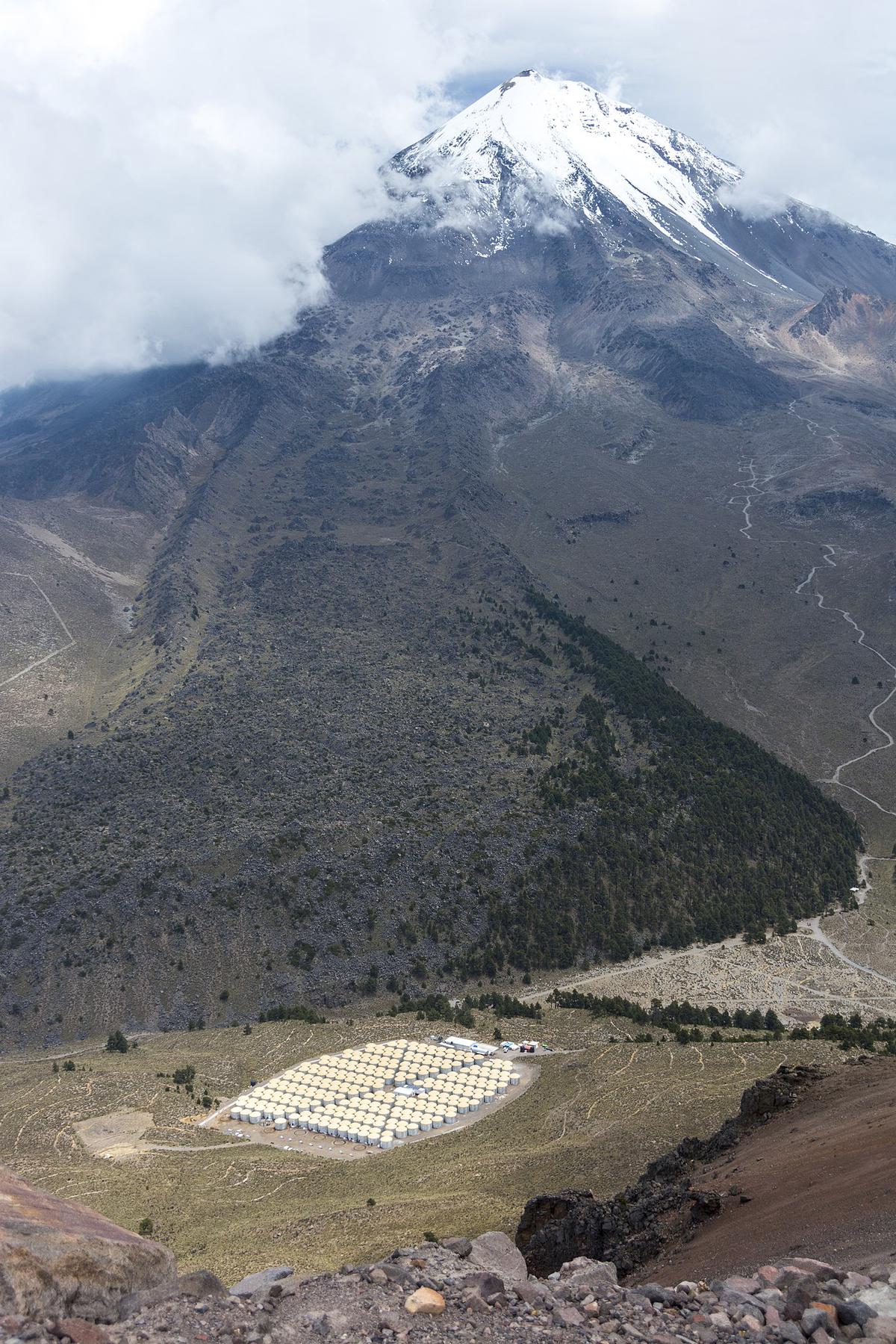 The HAWC detector is visible in the bottom-foreground under the peak of Mexico’s highest mountain, Pico de Orizaba, August 19, 2014.