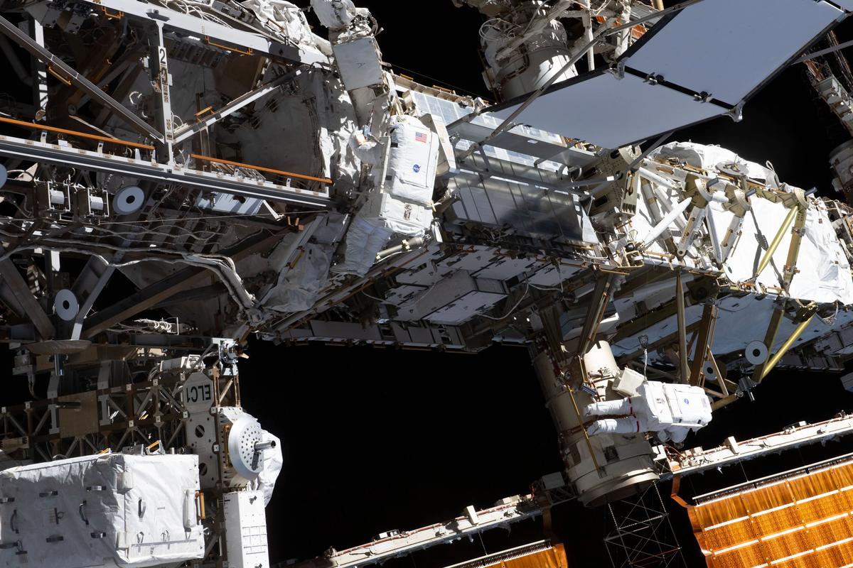 Expedition 70 flight engineers Loral O’Hara (centre) and Jasmin Moghbeli (lower right), both from NASA, are pictured tethered to the ISS’s port truss structure during a spacewalk to replace one of the 12 trundle bearing assemblies on the port solar alpha rotary joint, which allows the arrays to track the Sun and generate electricity.