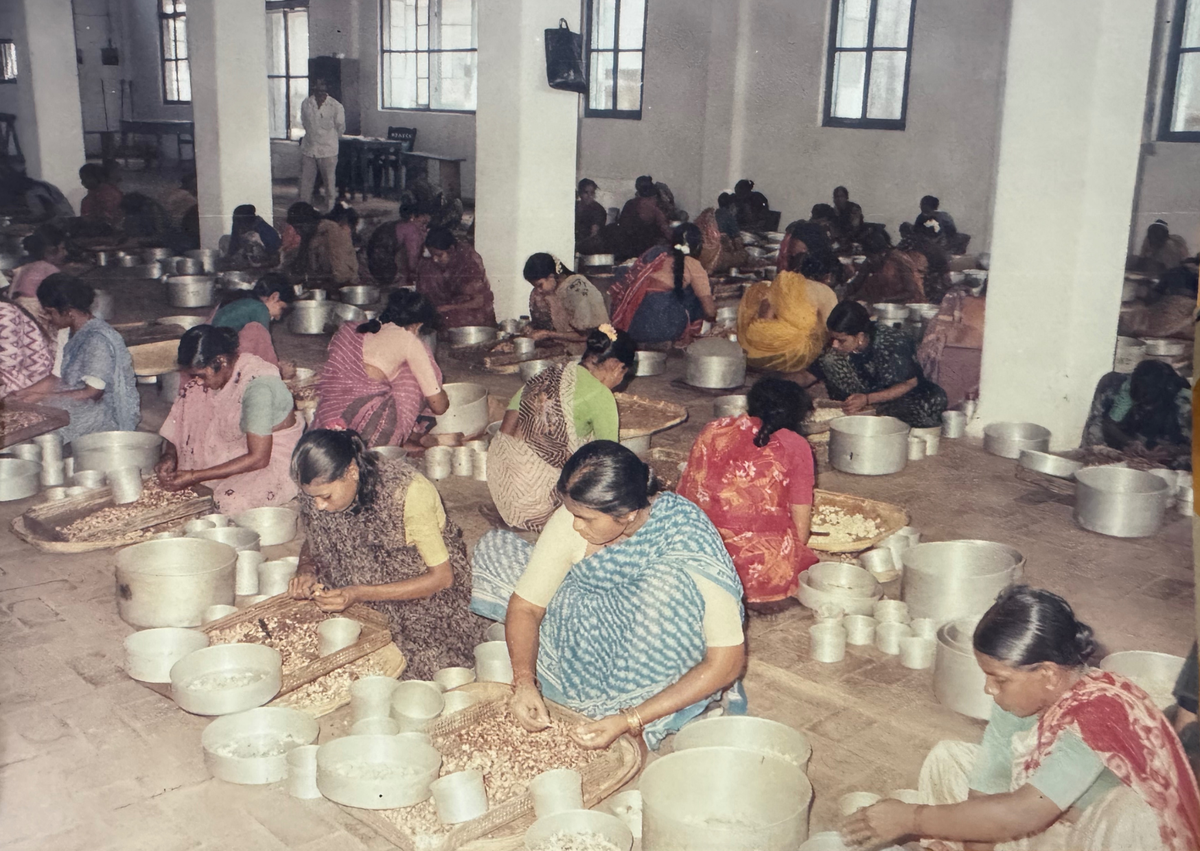 A photograph from Fr Leo’s collection showing women working at a cashew processing plant.