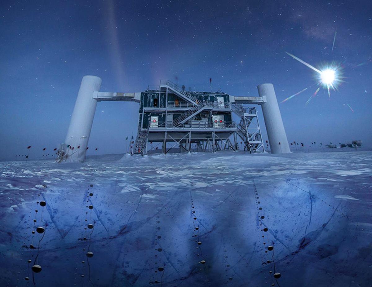 The IceCube experiment in the Antarctic, shown here in an illustration, uses long strings of light detectors buried under the ice to detect tiny flashes from occasional interactions with passing neutrinos.
