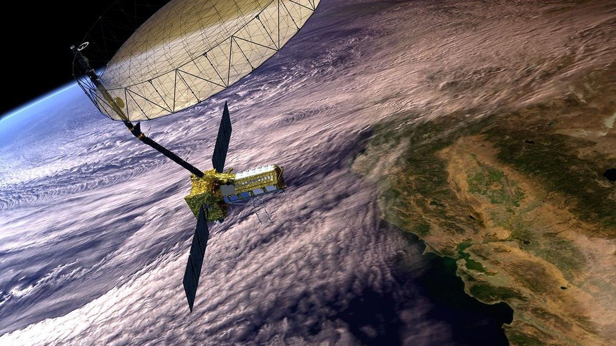 An artist’s illustration of NISAR orbiting the earth. The 12-m-wide reflector is seen deployed. An artist’s illustration of NISAR orbiting the earth. The 12-m-wide reflector is seen deployed.
