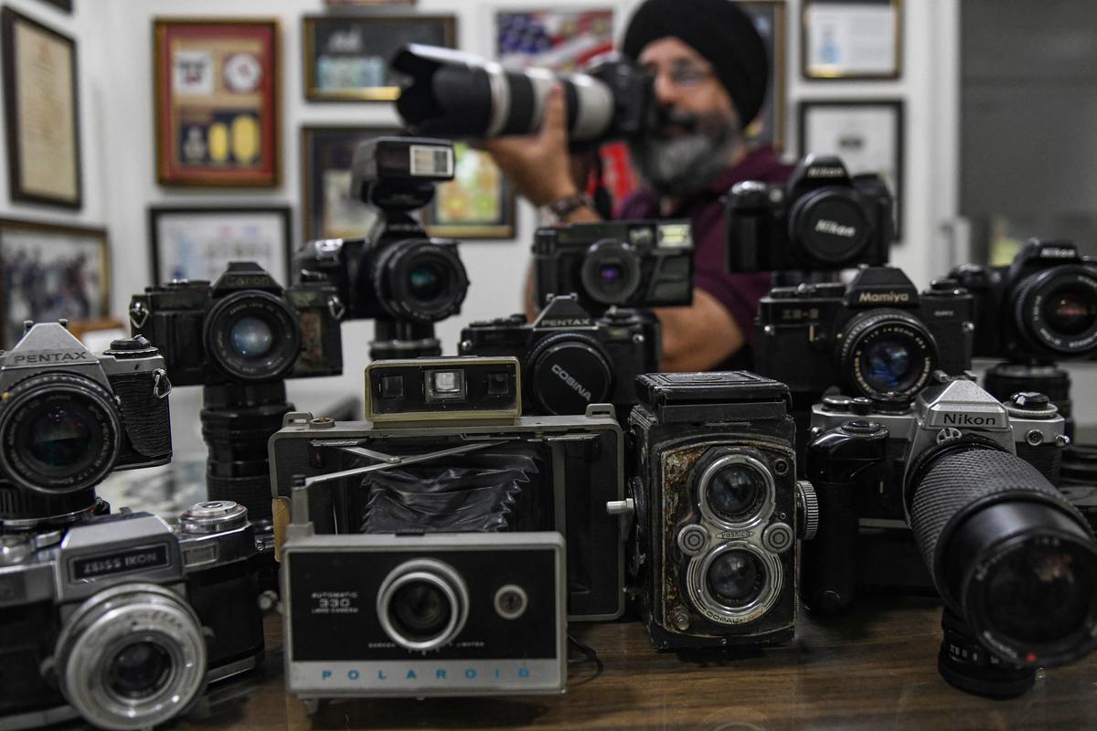 Film cameras come in a range of form-factors and use film rolls and canisters of different sizes [File]