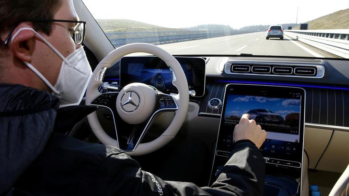 Mercedes bets on evolution as Tesla touts revolution in automated driving