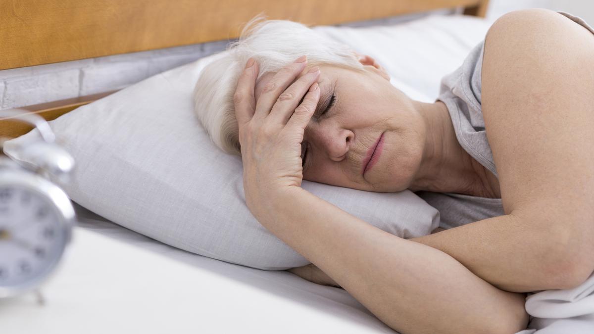 What causes the interrupted sleep of the elderly?