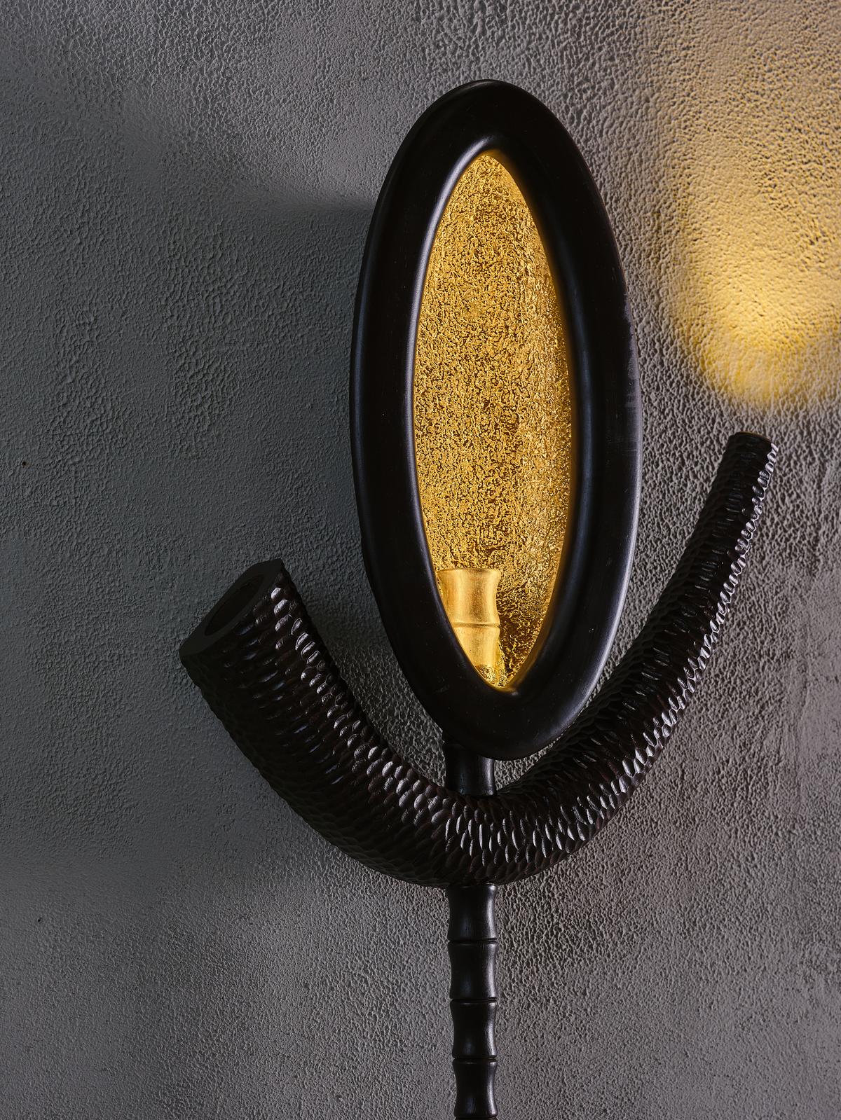 The Tilak Wall Sconce references the ancient cosmic symbol of the tilak. The Tilak Wall Sconce references the ancient cosmic symbol of the tilak.