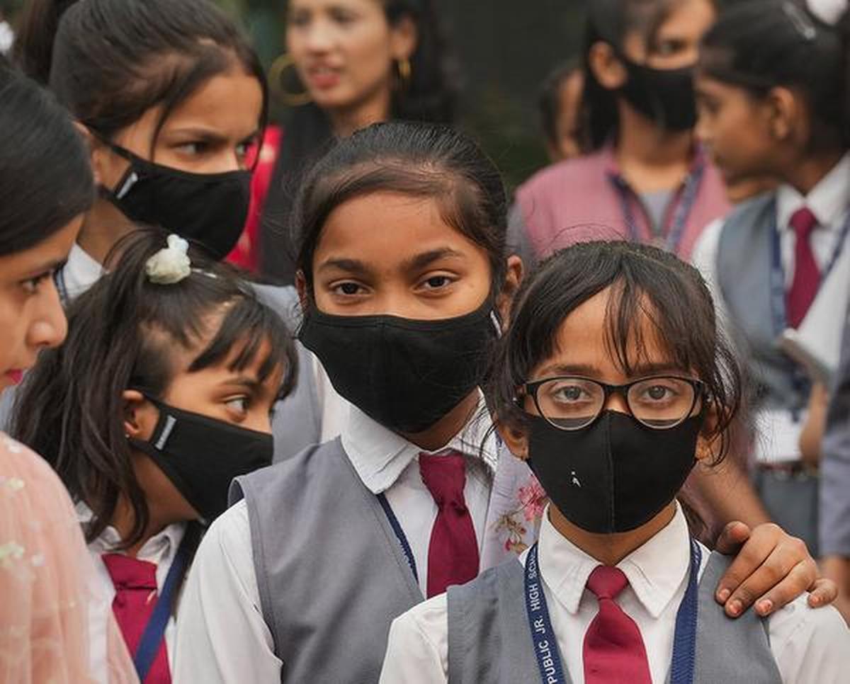Students in masks at the Kartavya Path amid dense smog near the India Gate in New Delhi. Students in masks at the Kartavya Path amid dense smog near the India Gate in New Delhi.