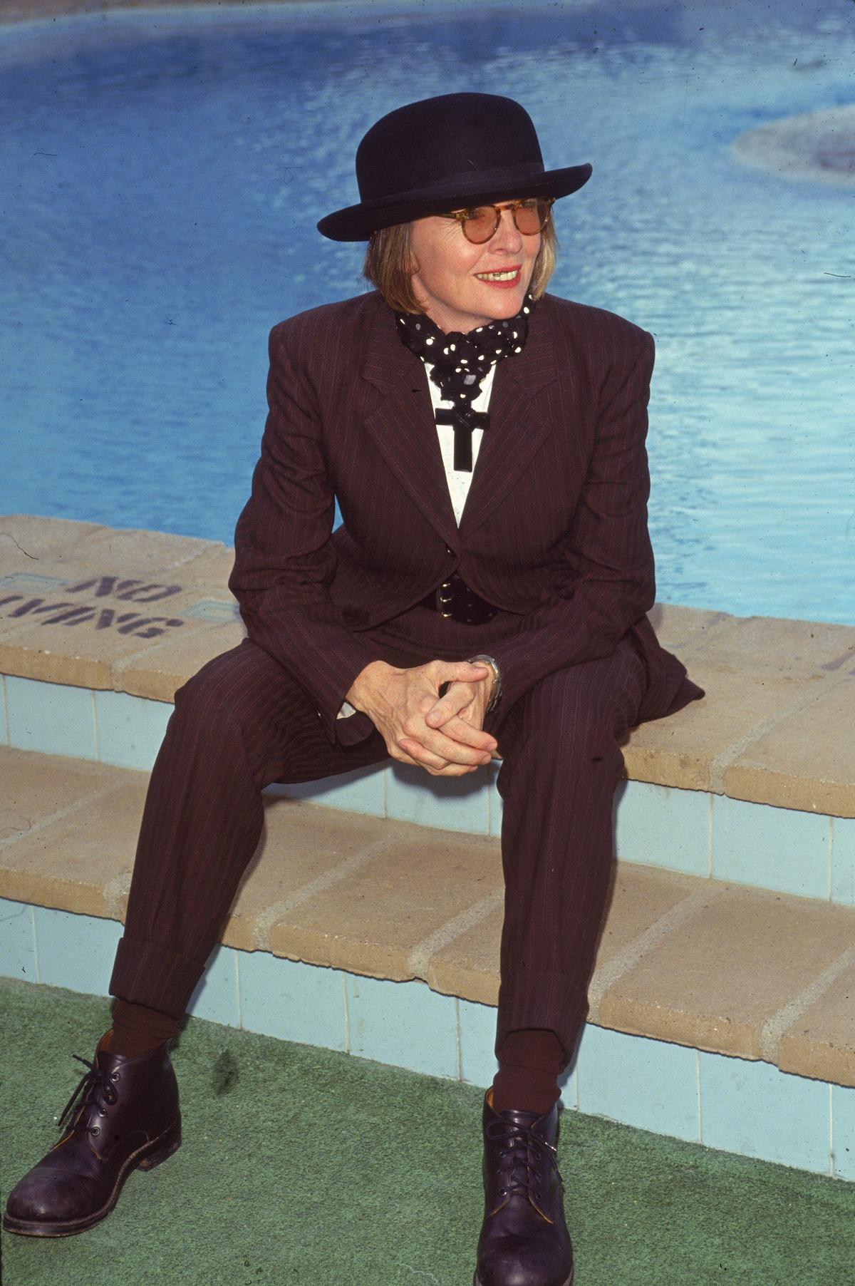 Actor Diane Keaton in 1996. She wears a purple & black striped suit, bowler hat, and, around her neck, wears a large black crucifix. (Getty Images) Actor Diane Keaton in 1996. She wears a purple & black striped suit, bowler hat, and, around her neck, wears a large black crucifix. (Getty Images)