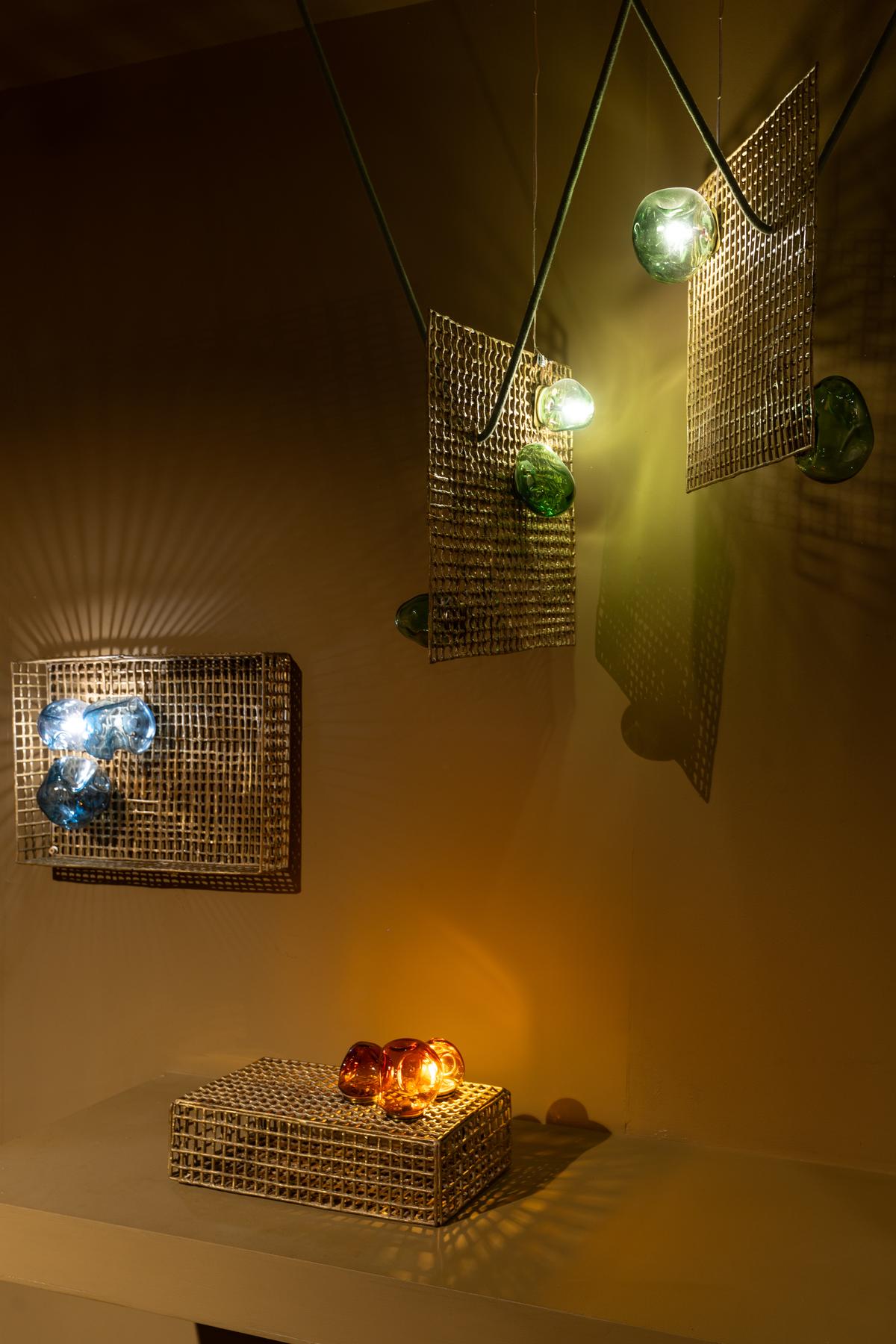 Le Nid is crafted from blown glass on a brass Dhokra shell.