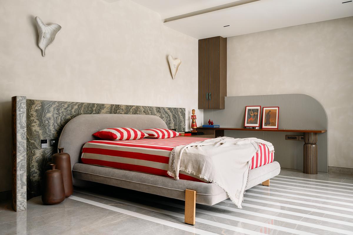 In one of the bedrooms, a medley of stripes intersects with the veining of burl veneer. Styling: Fymin Naif and Nimitha Harith.