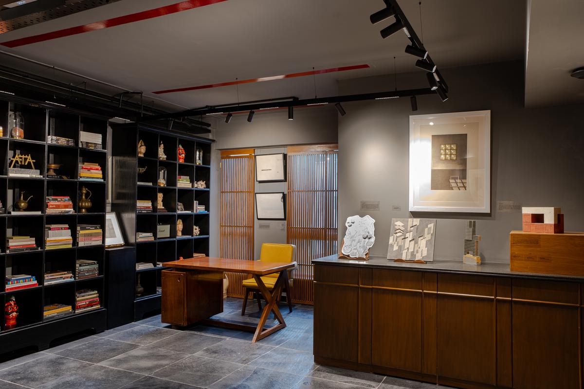 The desk is a childhood heirloom, a Pierre Jeanneret piece made of teak.