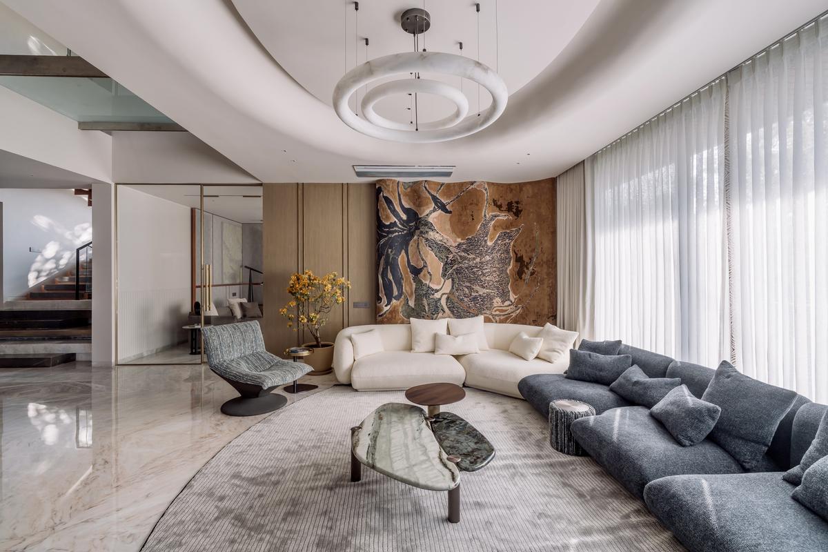 A bold fabric panel serves as a showstopper in this living room accent wall. 