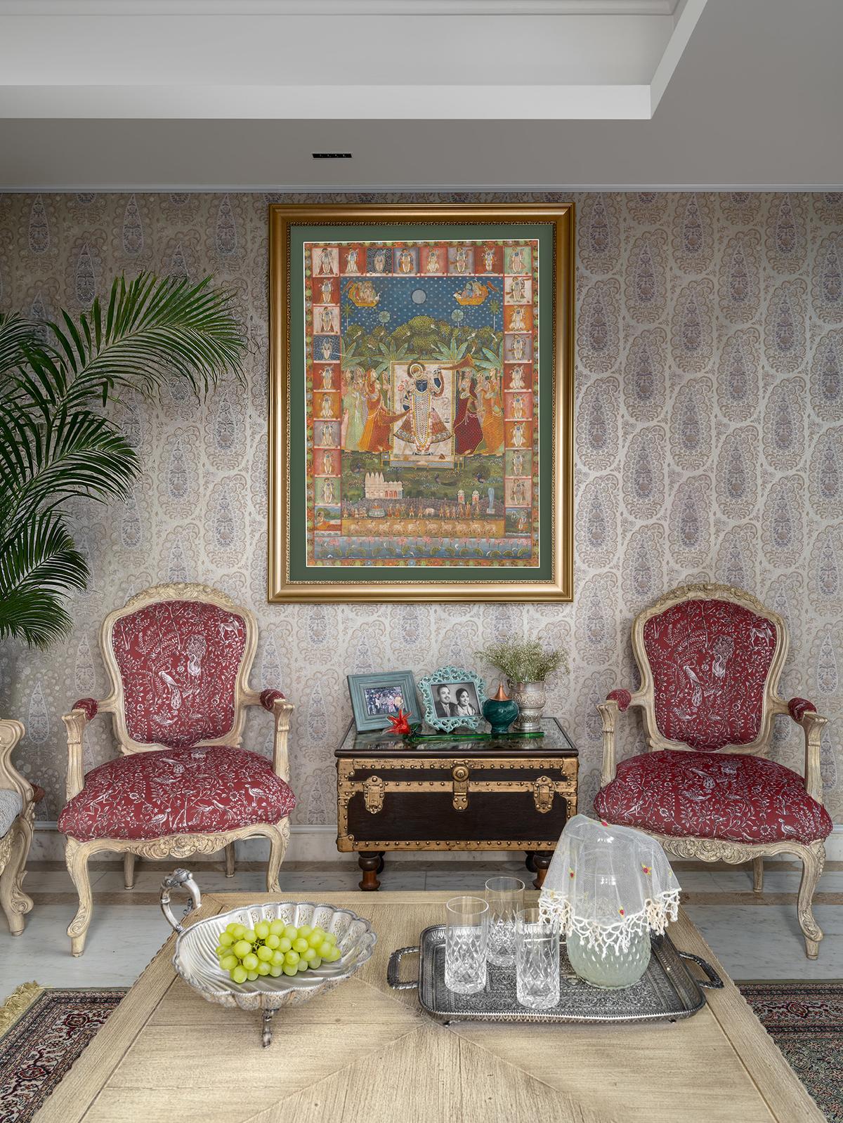 Paisley-patterned wallpaper and block-printed upholstery bring floral and Mughal-inspired motifs into this intimate seating corner. Paisley-patterned wallpaper and block-printed upholstery bring floral and Mughal-inspired motifs into this intimate seating corner.