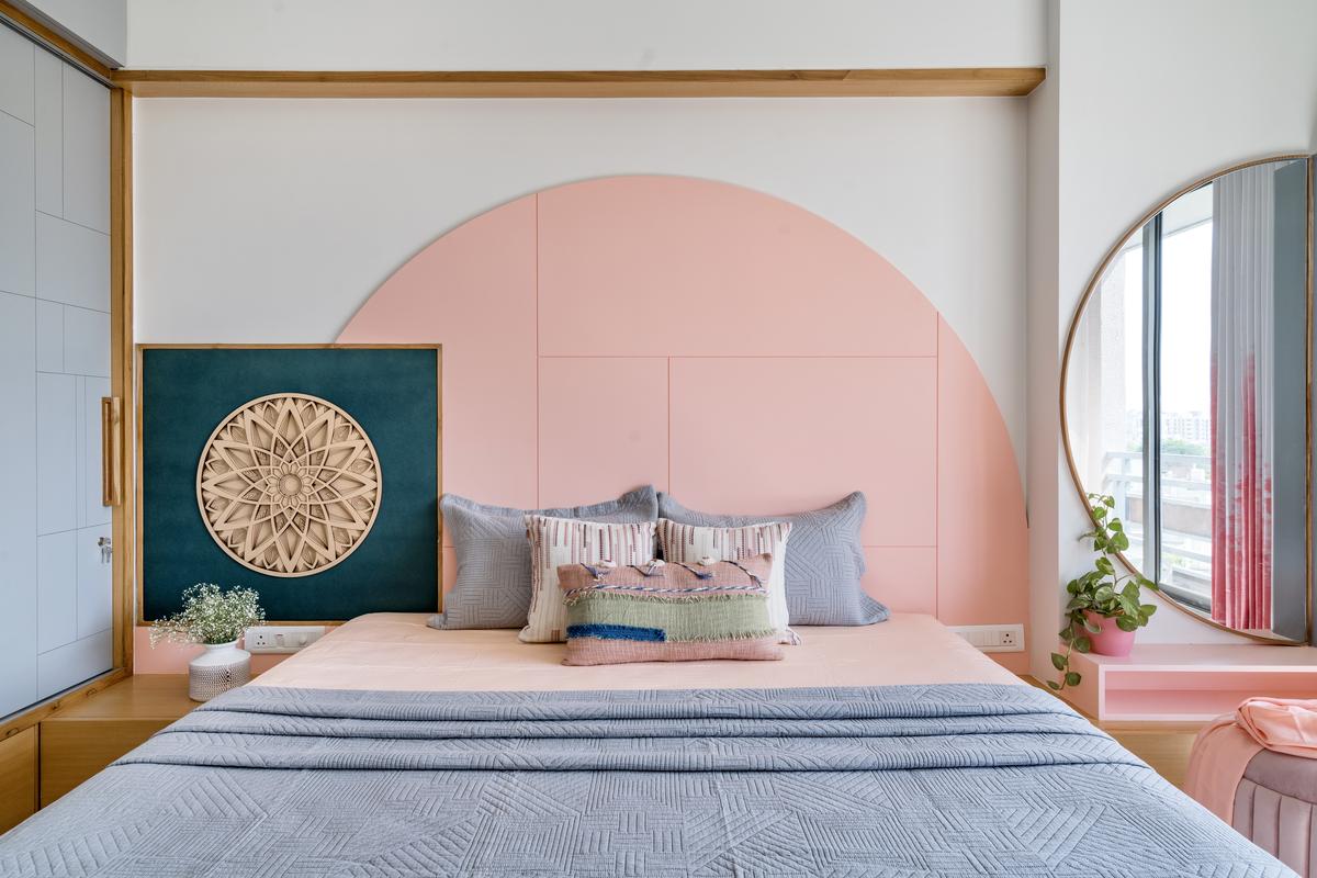 A play of geometric shapes and colours in this bedroom wall balances tradition with modernity.
