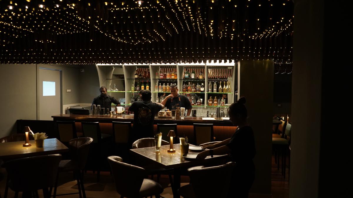  The bar at MadCo. with a starry sky effect. from thousands of fairy lights ensconced in wooden modules. 