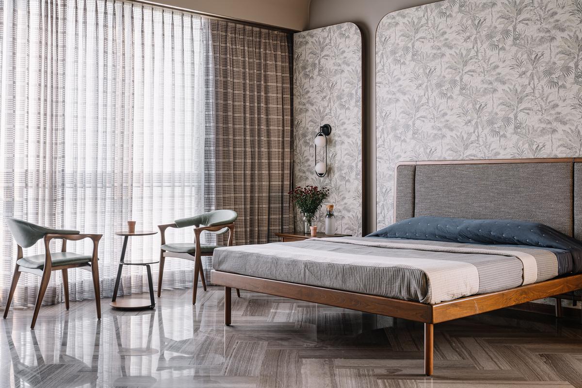 The master bedroom has tobacco brown marble laid in the typical herring bone pattern, with  resemblance to wood.