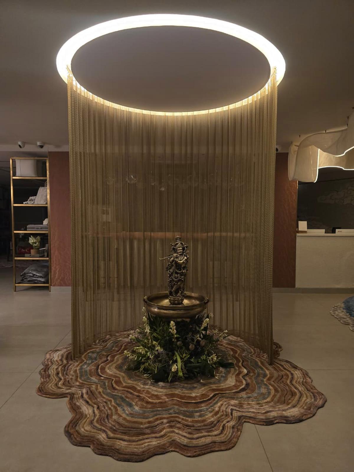 Vishvesh’s custom-designed rug that shows the natural rings of a tree, symbolising the growth and years of the store.