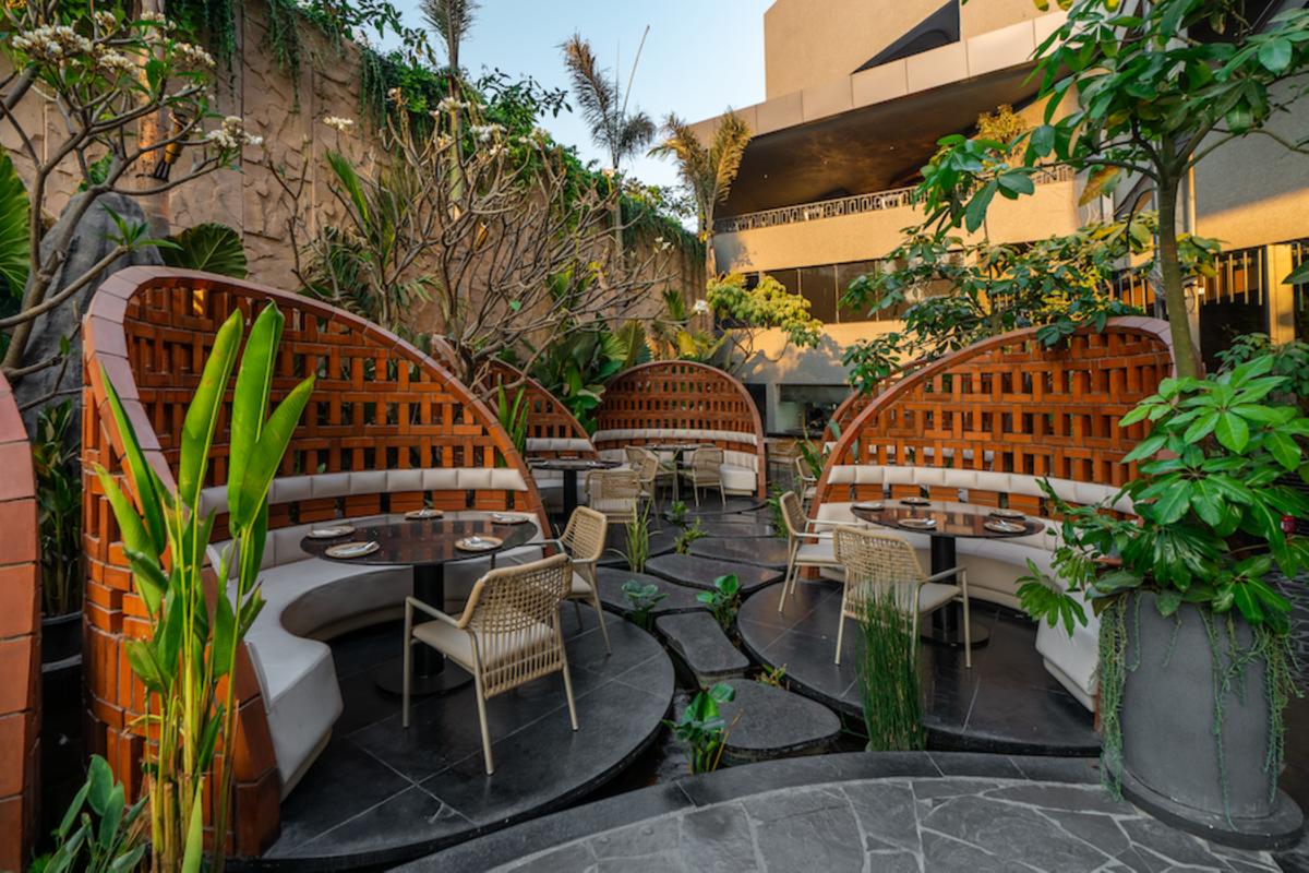 An inbuilt brick seating with partition wall that ensures airflow and is surrounded by a serene koi pond. An inbuilt brick seating with partition wall that ensures airflow and is surrounded by a serene koi pond.