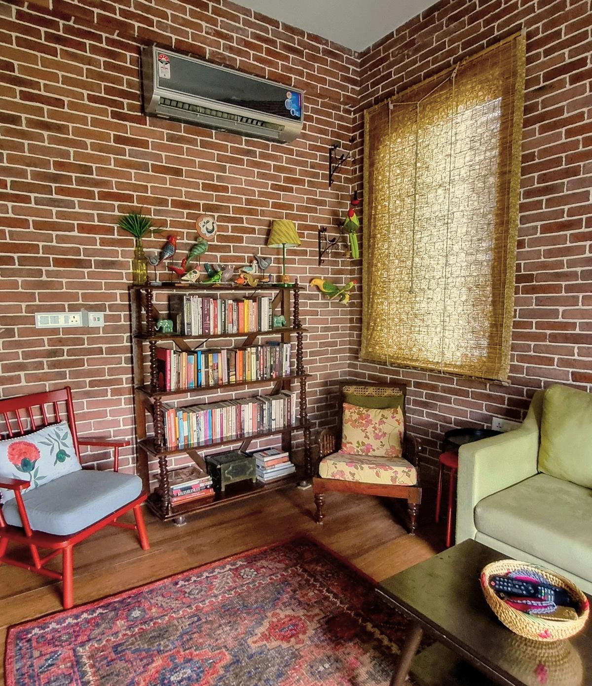 Brick walls add rustic charm in Manjul Misra’s library. Brick walls add rustic charm in Manjul Misra’s library.