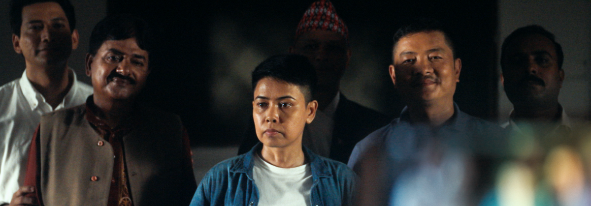 Asha Magrati (centre) in a still from the film ‘Pooja, Sir’ (2024).