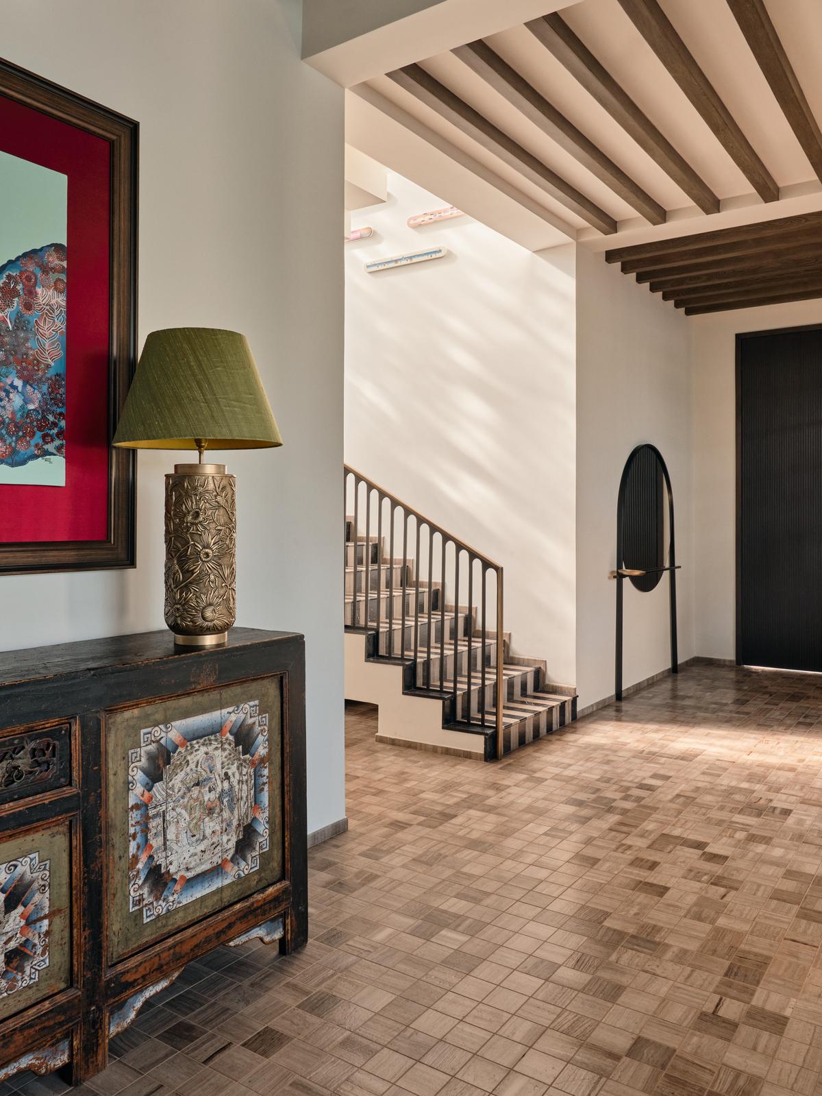 At Hermitage, the studio celebrates tactile materiality, the monochrome stone pairing on the stairs giving way to a matrix of sepia. Styling: Samir Wadekar.