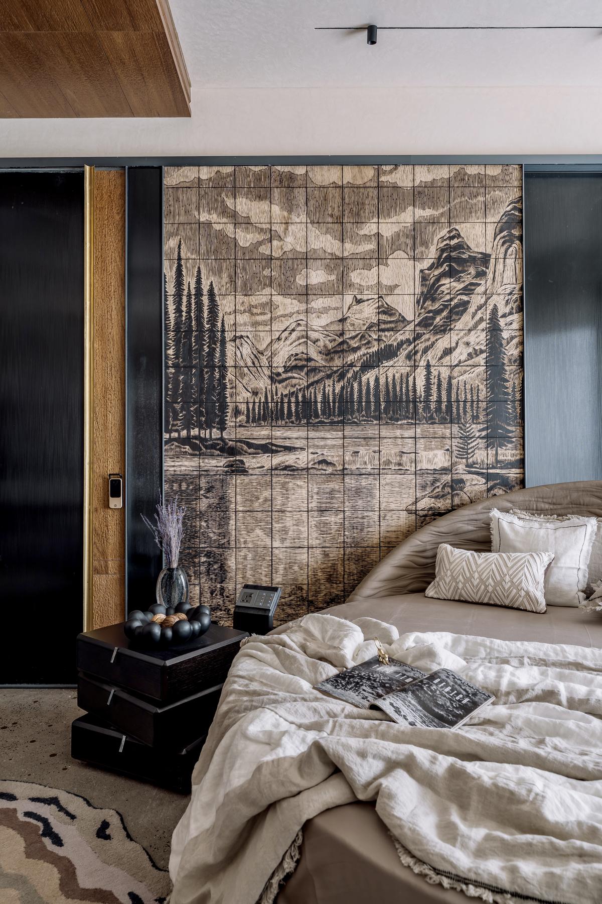 Earthy hues add charm and calm to this bedroom feature wall. 