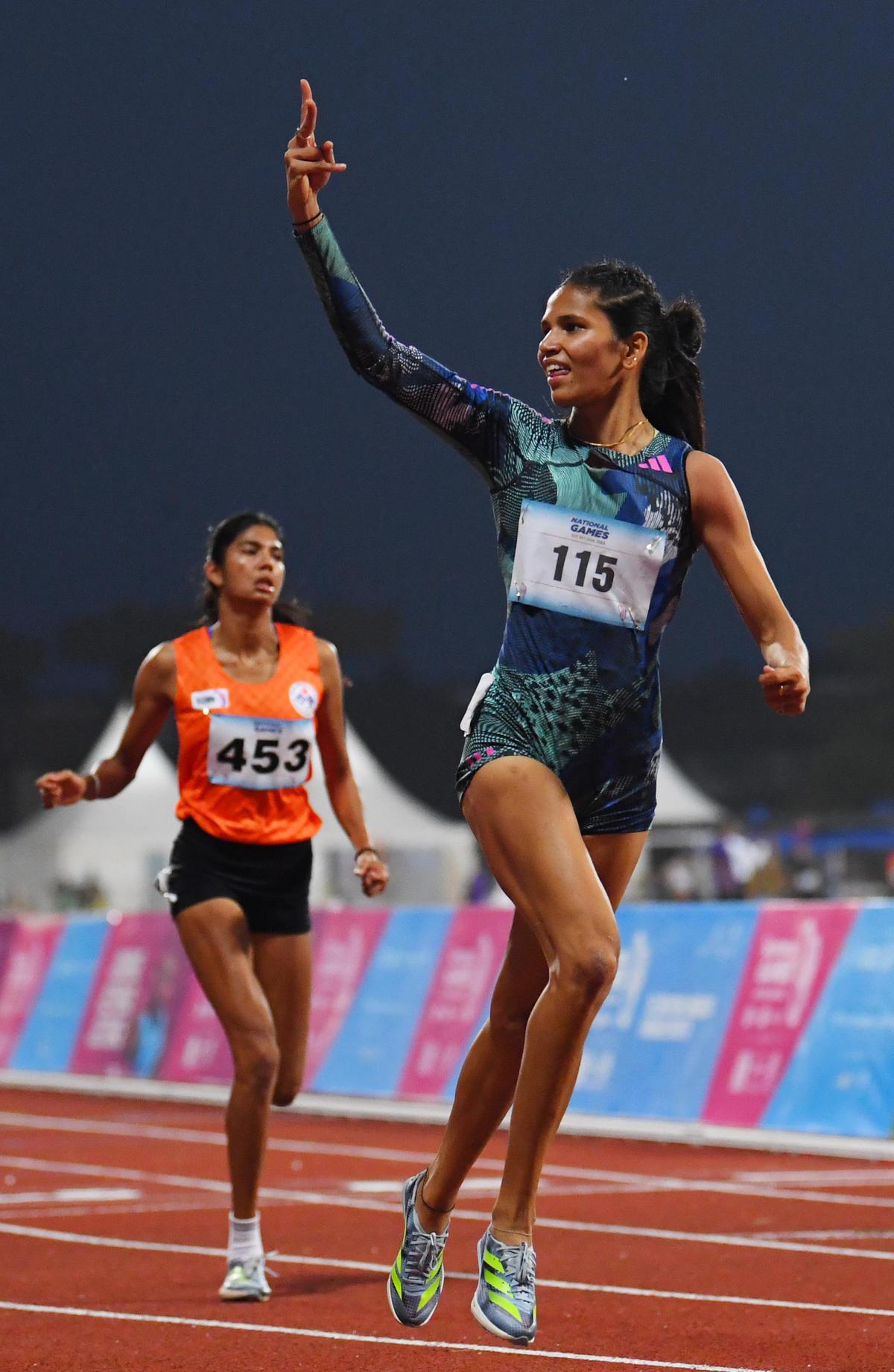 Jyothi Yarraji celebrates her 100m hurdles victory and meet record at the National Games in Panaji on Monday. 