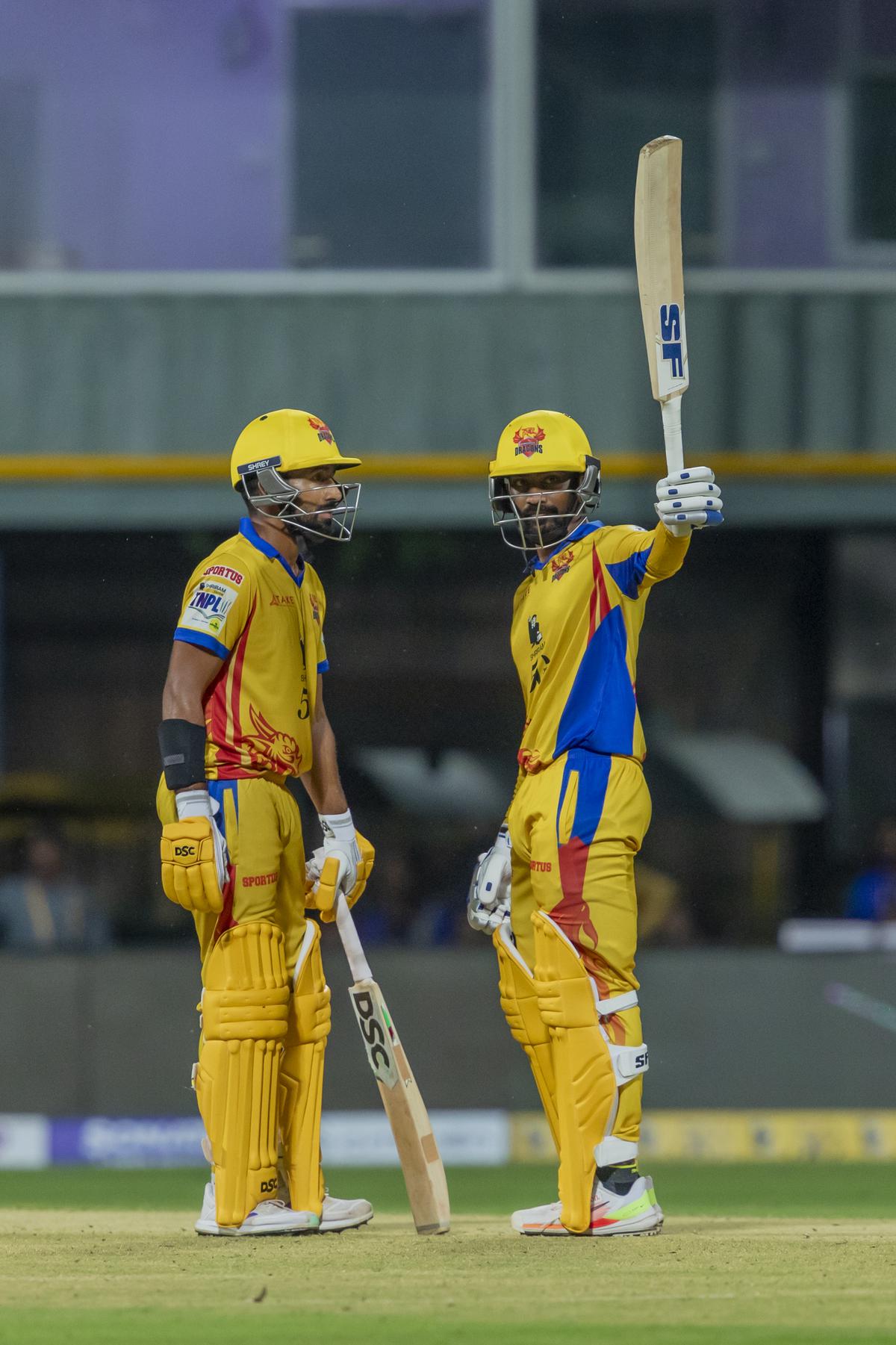 Sealing it: The 92-run partnership between Indrajith, right, and Ganesh took Dragons home.