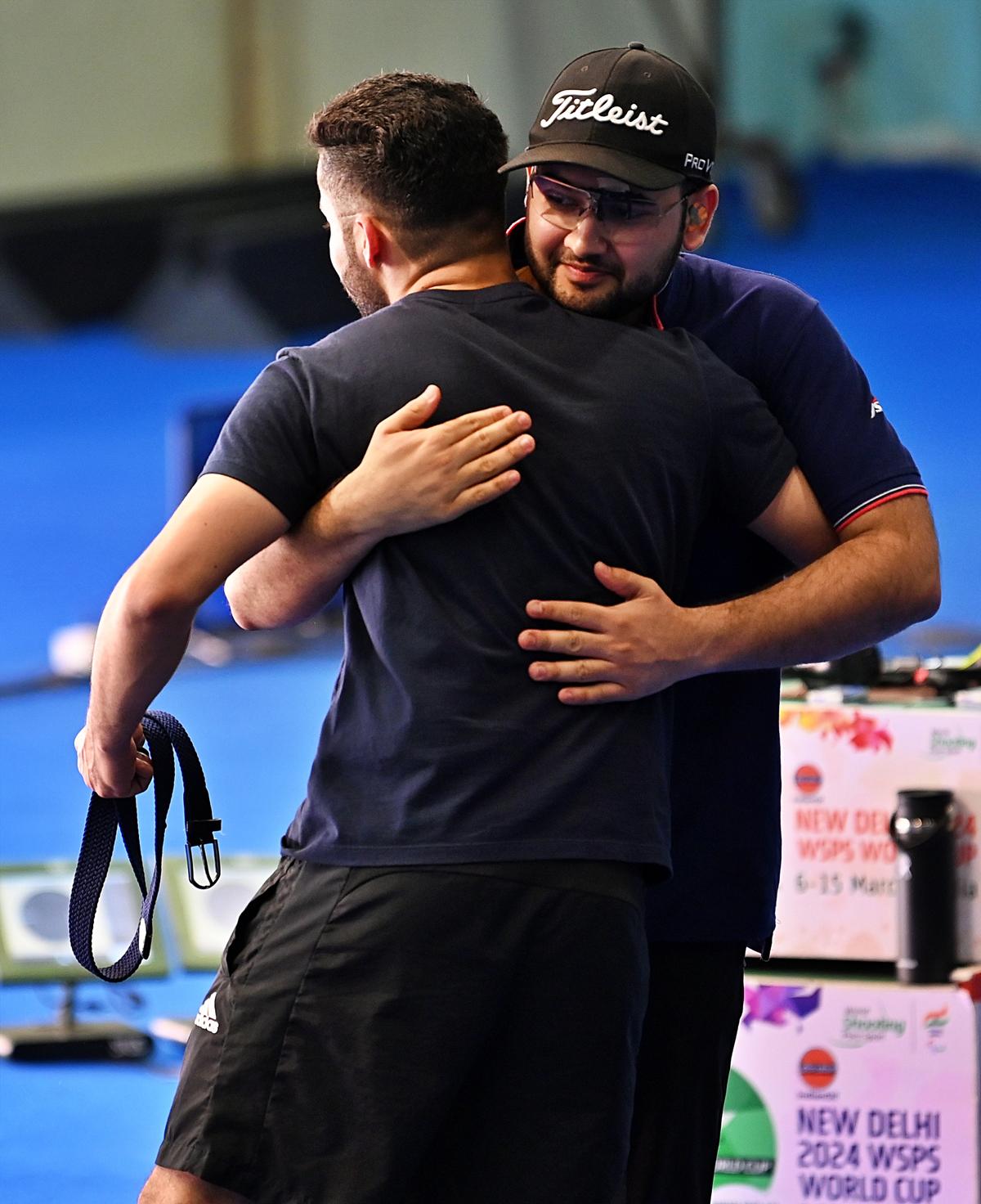 Anish and Vijayveer after the rapid fire pistol final.