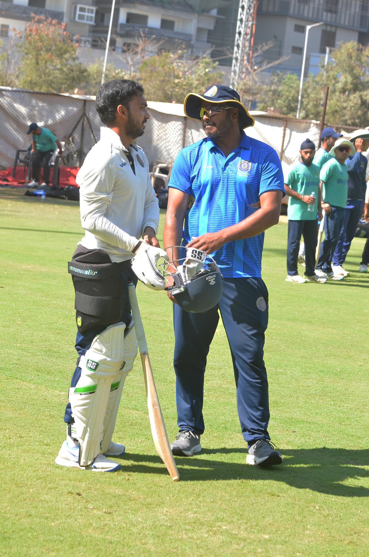 Hyderabad opener and lead scorer this season Tanmay Agarwal with coach D.B. Ravi Teja on the eve of the Ranji Trophy Plate Group final against Meghalaya at Rajiv Gandhi Stadium in Hyderabad on Friday.