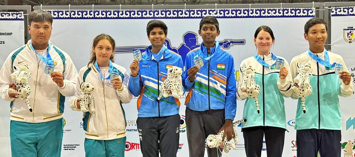 Tanisska Senthilkumar and Yugan Muthukumaar with the mixed trap youth gold along with teams from Uzbekistan and Kazakhstan in the Asian Championship in Kazakhstan on Thursday. Tanisska Senthilkumar and Yugan Muthukumaar with the mixed trap youth gold along with teams from Uzbekistan and Kazakhstan in the Asian Championship in Kazakhstan on Thursday.