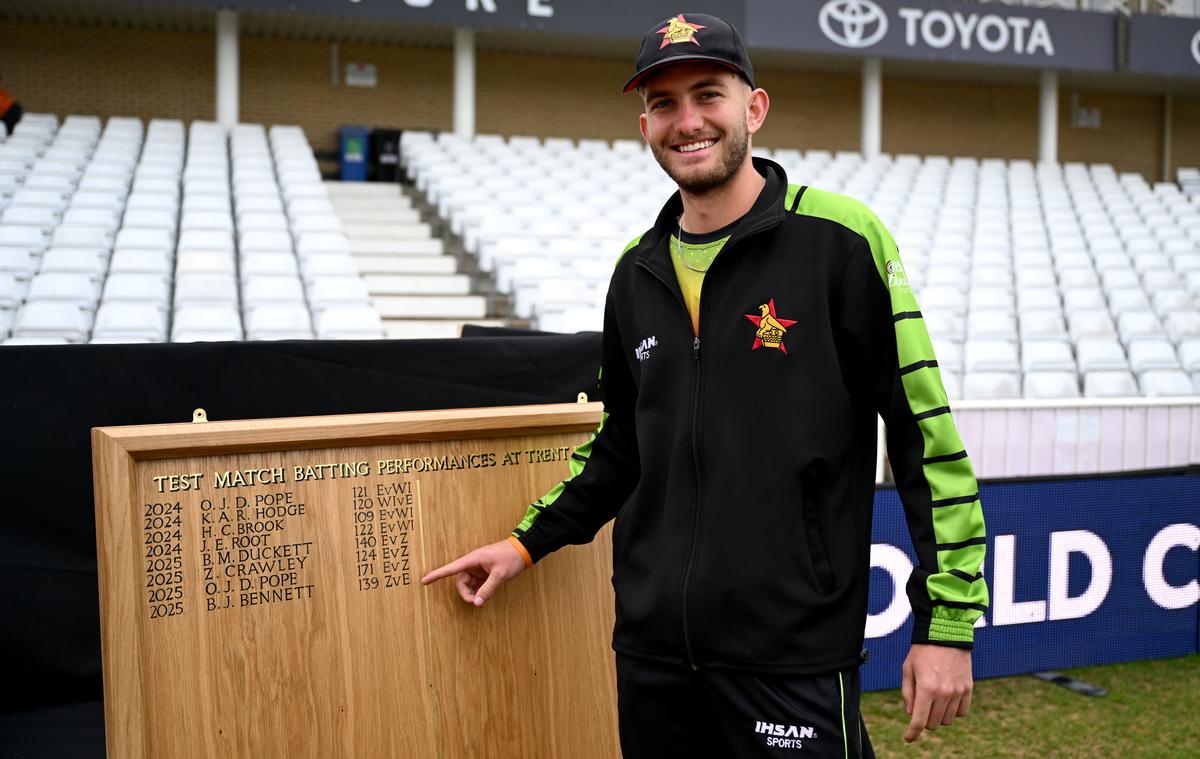 Brian Bennett of Zimbabwe points at his place on the batting Honours Board at Trent Bridge.