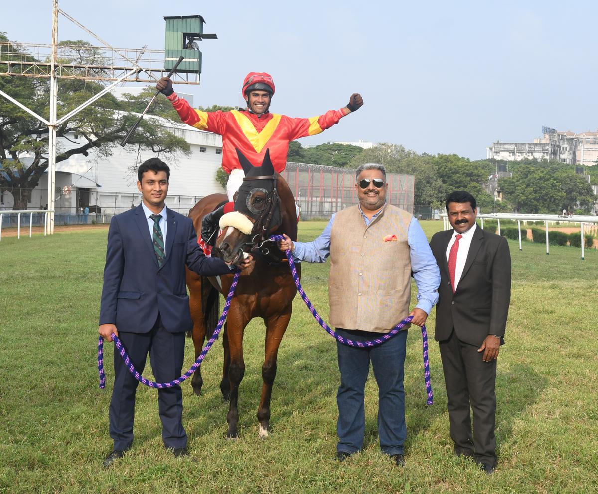 Mysterious Angel (Ajeeth Kumar astride) being led in by breeder Himmat Singh Dhillon, second from right,  and P. Krishna, right, after her success in the South India Oaks at the Madras Race Club on Friday.