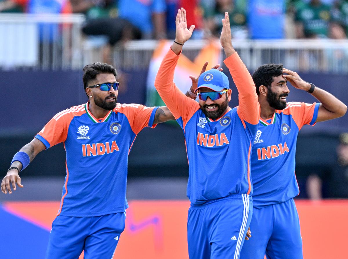 Rohit Sharma celebrates the win with Jasprit Bumrah and Hardik Pandya during the ICC Men’s T20 World Cup cricket match between India and Pakistan.