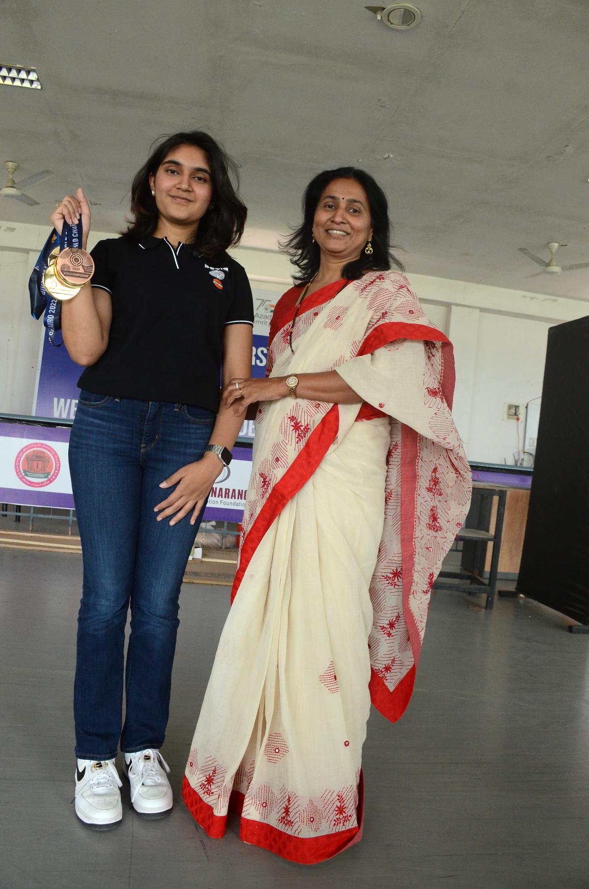 Esha, who won three gold and a bronze medal in the recent ISSF World championship in Cairo, with mother Srilatha on Tuesday.