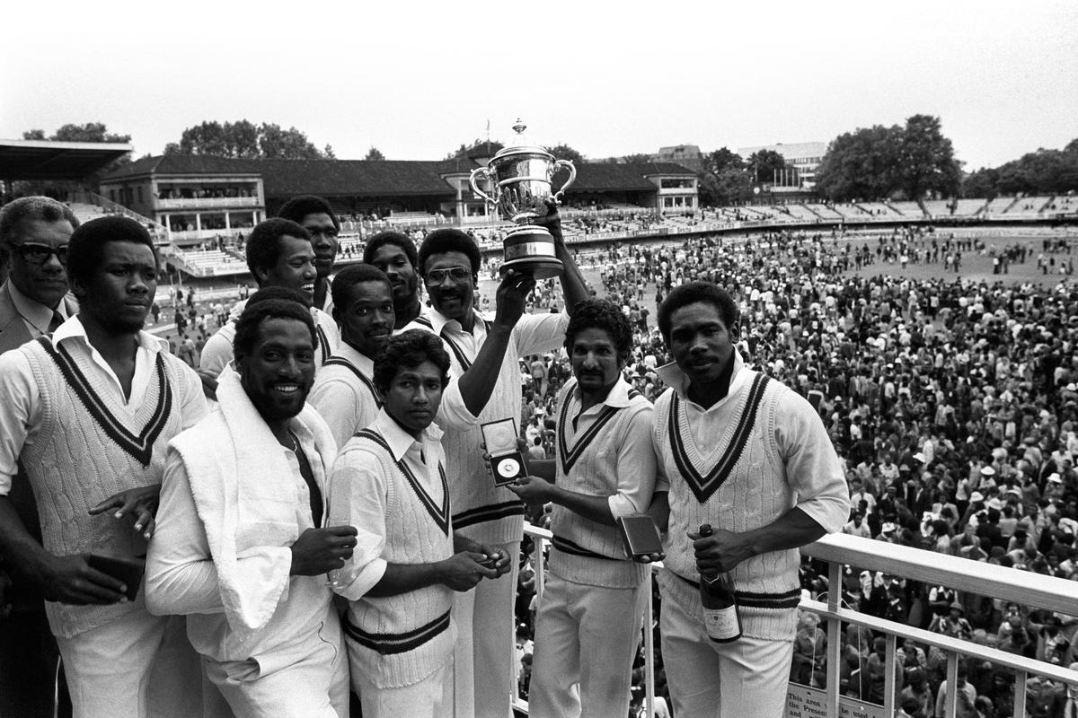 West Indies Captain Clive Lloyd surrounded by his players as he displays the 1979 Prudential Cup. 