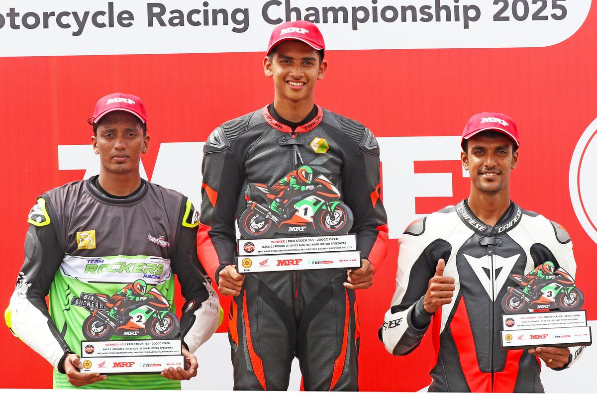 Savion Sabu, winner of the Pro Stock 200cc Open race, flanked by second-placed Mohan Babu, left, and third-placed P.M. Soory