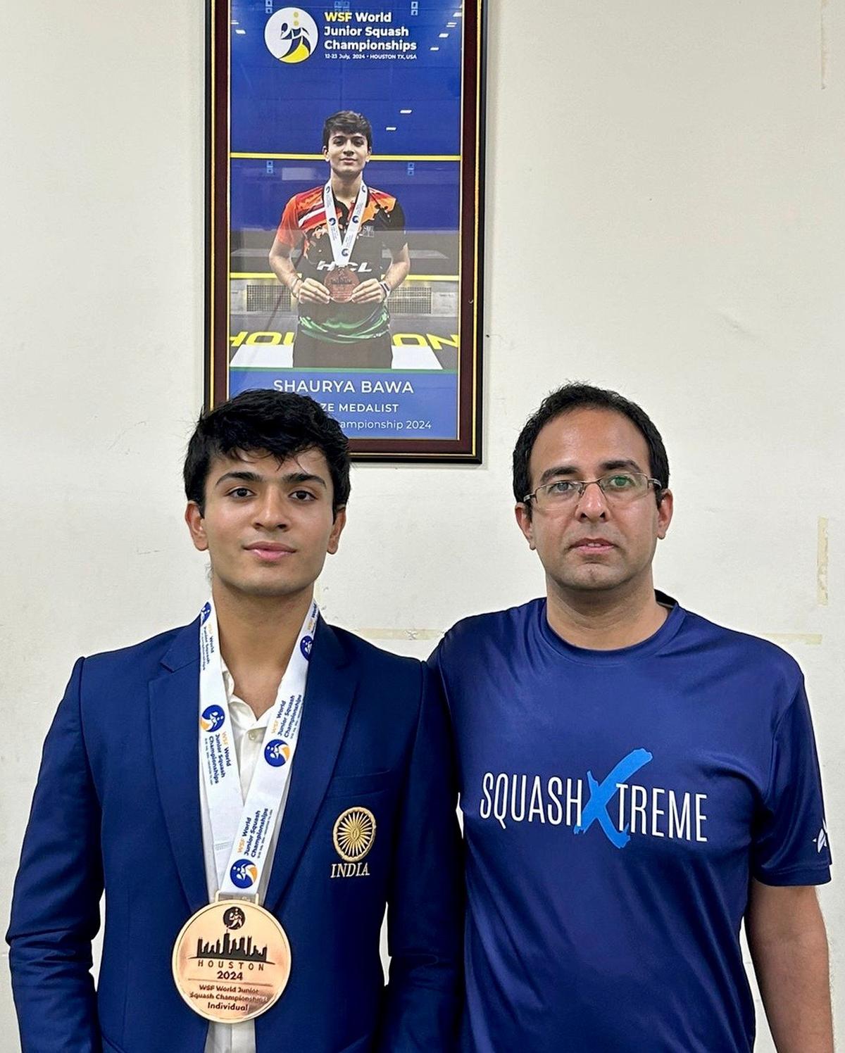 Shaurya Bawa with coach Dhruv Dhawan at the National Stadium in Delhi on Friday.