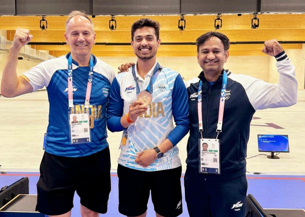 Swapnil flanked by Farnik and Manoj.