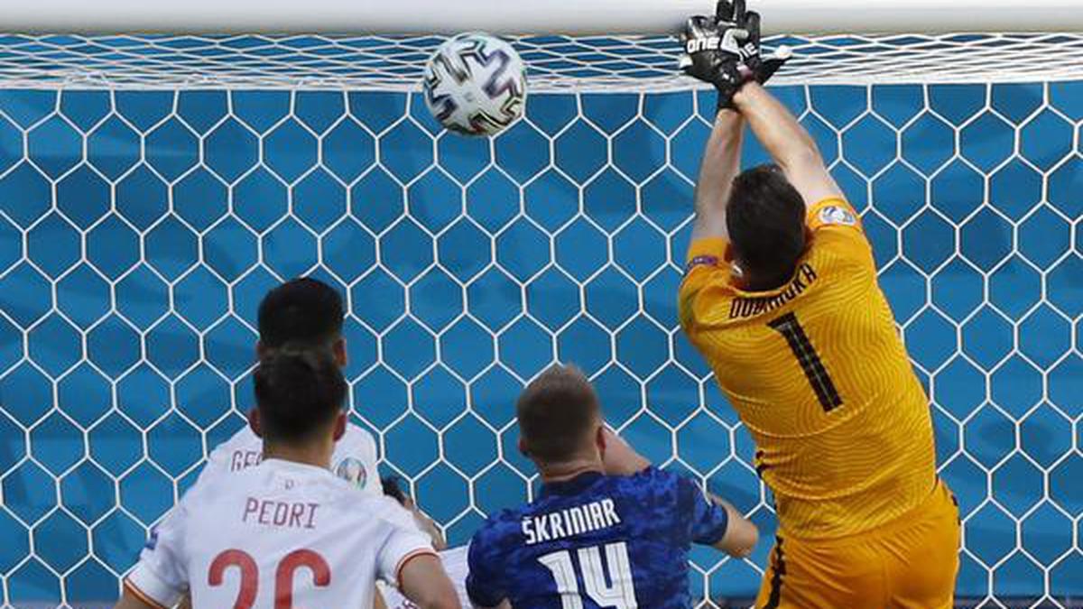 Bizarre own-goal helps Spain advance to last 16