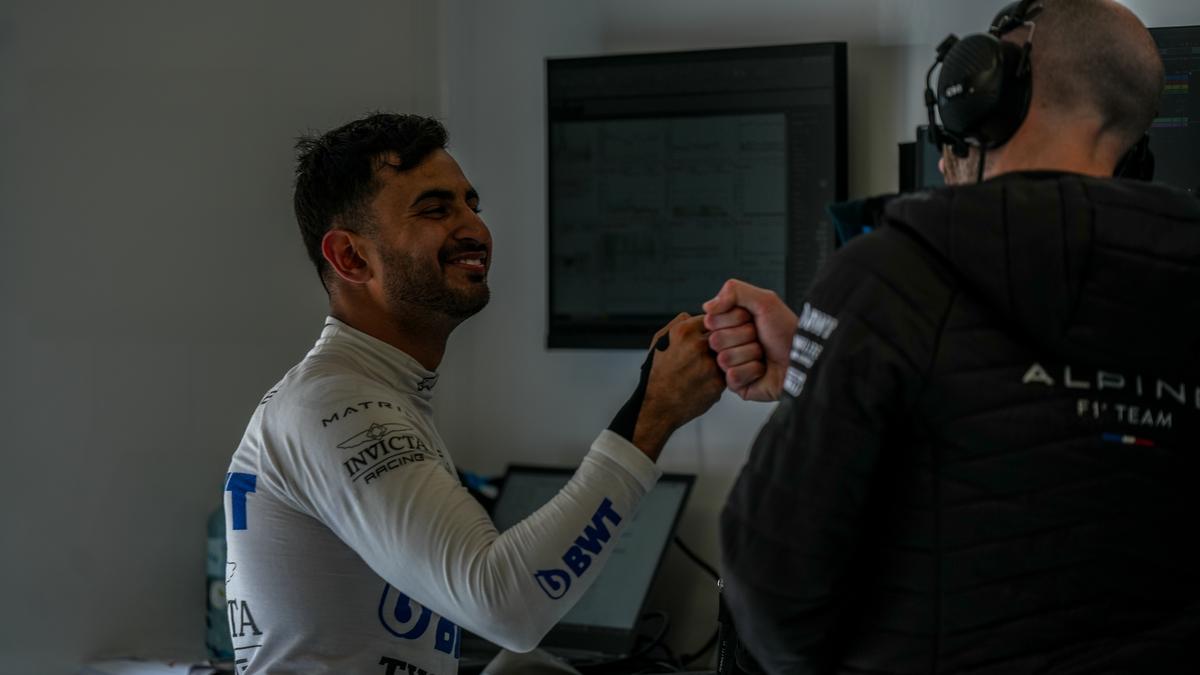 Kush Maini with an Alpine F1 team engineer.