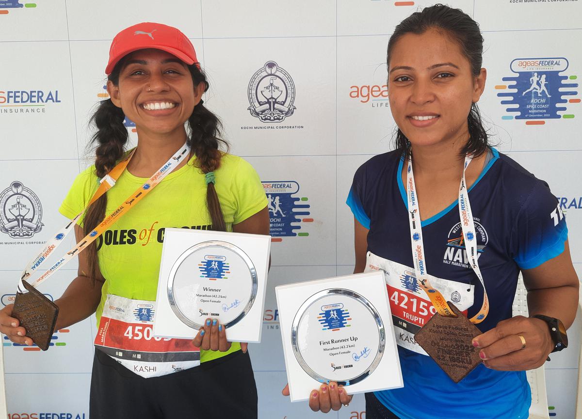Beating the odds: Kerala’s S. Gowri and Maharashtra’s Trupti Katkar Chavan, the women’s winner and runner-up of the Ageas Federal Life Insurance Kochi Spice Coast Marathon on Sunday.