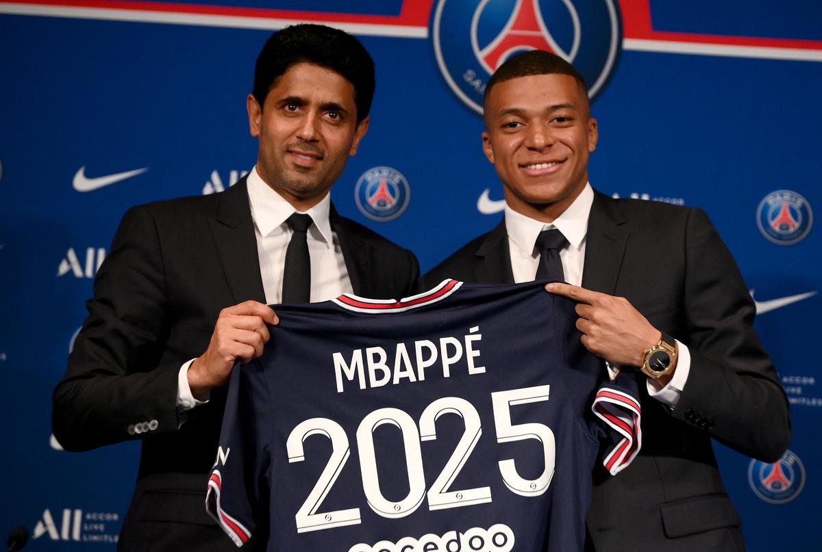 Mind the fine print: Mbappe held up a PSG shirt with the year 2025 during his contract announcement in 2022 with club president Nasser Al-Khelaifi, but there was a catch. It was a two-year contract running up to 2024 with an option for a 12-month extension, which the France captain did not trigger. | Photo credit: Getty Images